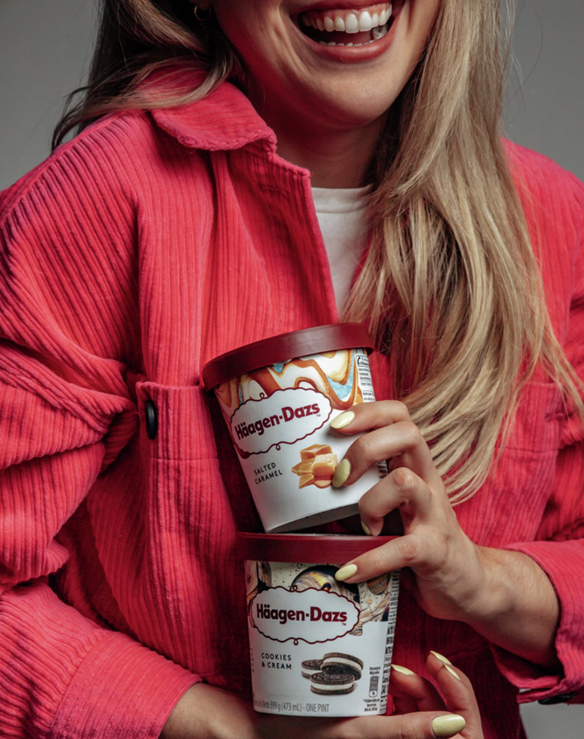 woman-having-haagen-dazs-pints-in-her-hand
